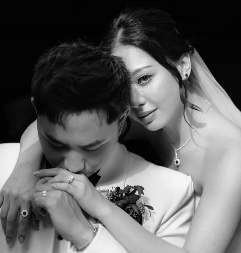 A close black-and-white wedding portrait of a couple.